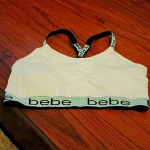 bebe light pink with silver glitter highlights sports bra.